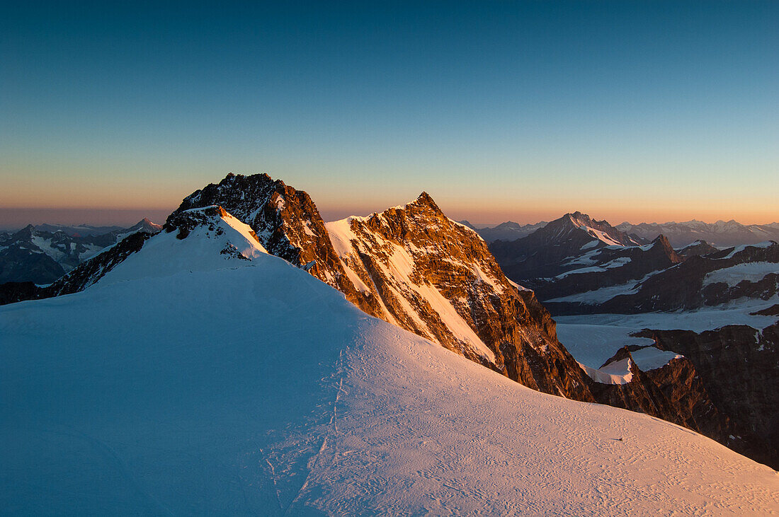 Sunrise on the Dufour peak and Nordend peak, the highest summits of Monte Rosa massif, Aosta Valley