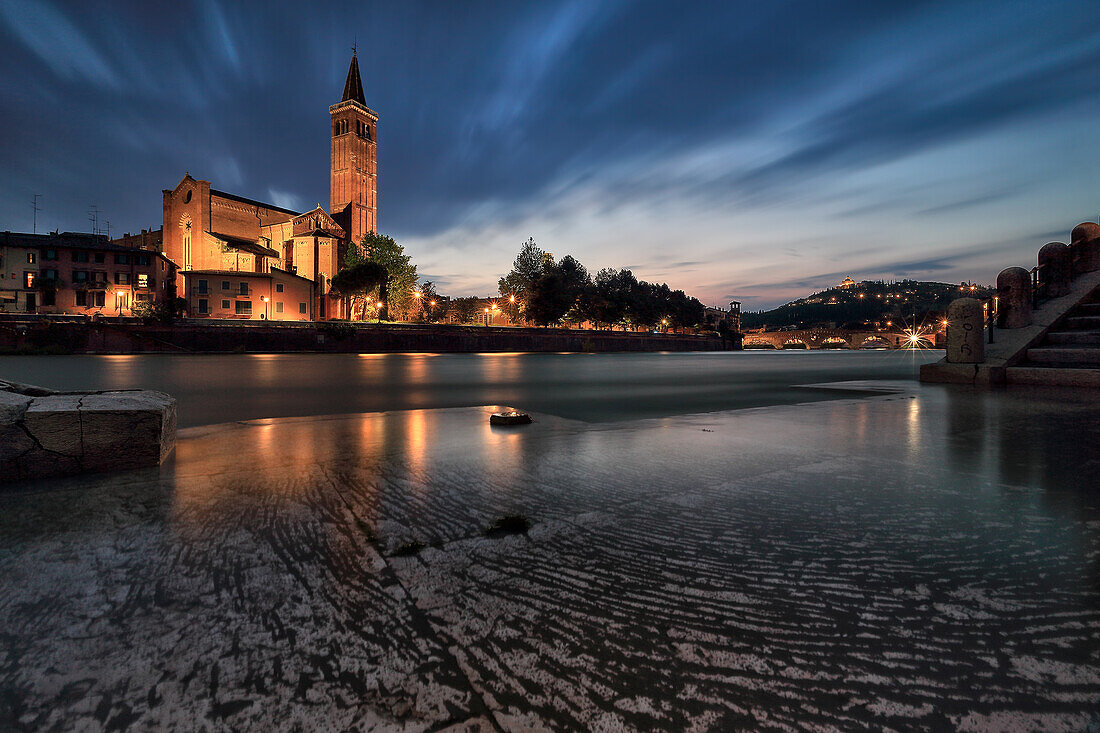 Sant'Anastasia in Verona reflect, during blue hour, into Adige River.