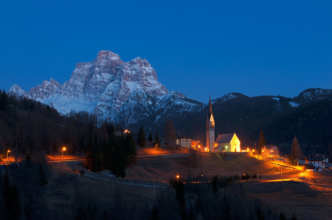 Selva di Cadore and his Church, late in the evening, with a view of Mount Pelmo in springtime, Dolomites.
