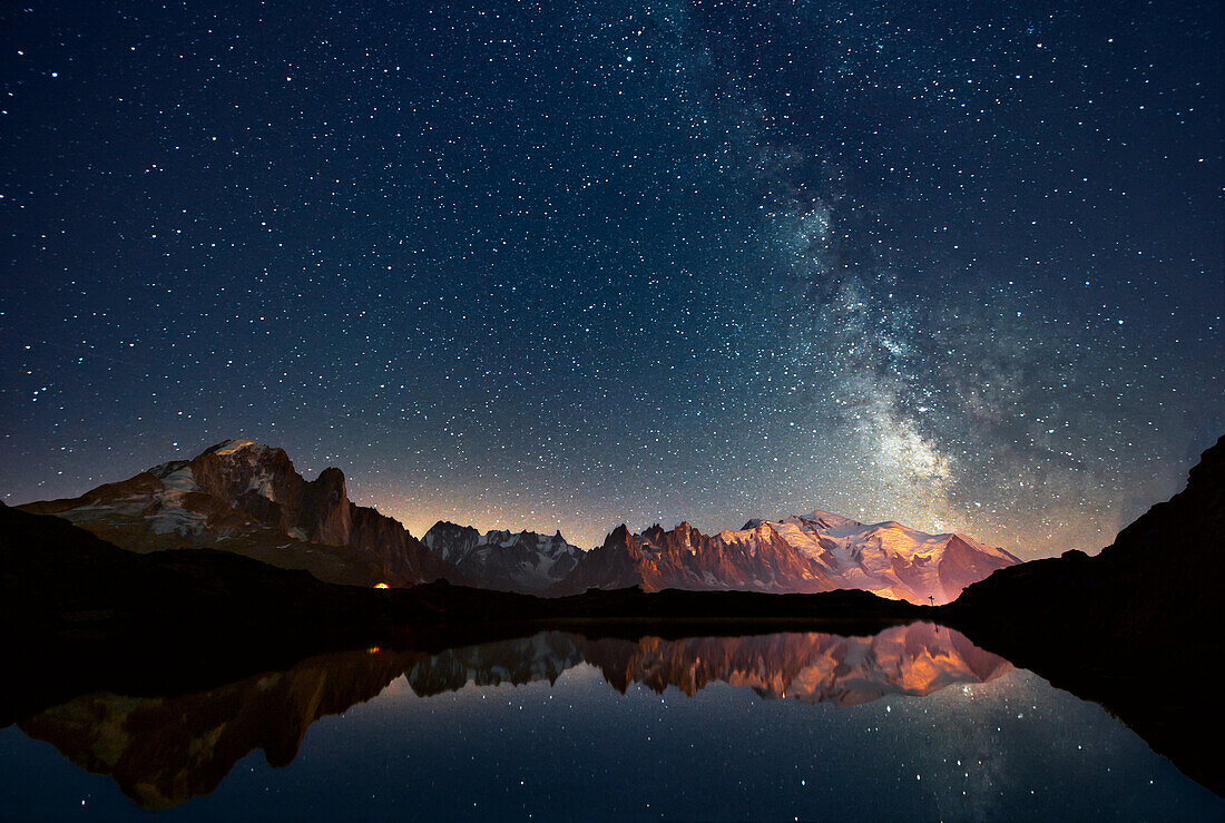 Milky way on Mount Blanc massif, reflected in an alpine lake, Chamonix