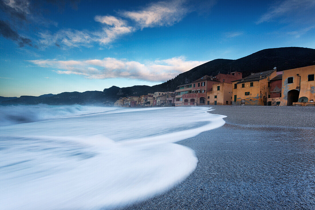 The fisherman village near at the sea in Varigotti town, La Spezia, Liguria, Italy. Beautiful vision of the waves near the house in the beach