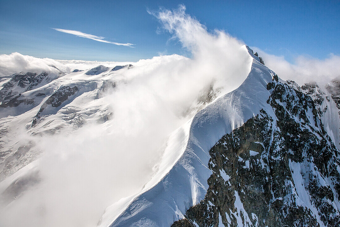 The sinuous shape of the Biancograt at the Piz Bernina, one of the most famous peaks of the Alps , 4050 m., Bernina, Alps, Engadin, Canton Graubuenden, Switzerland.