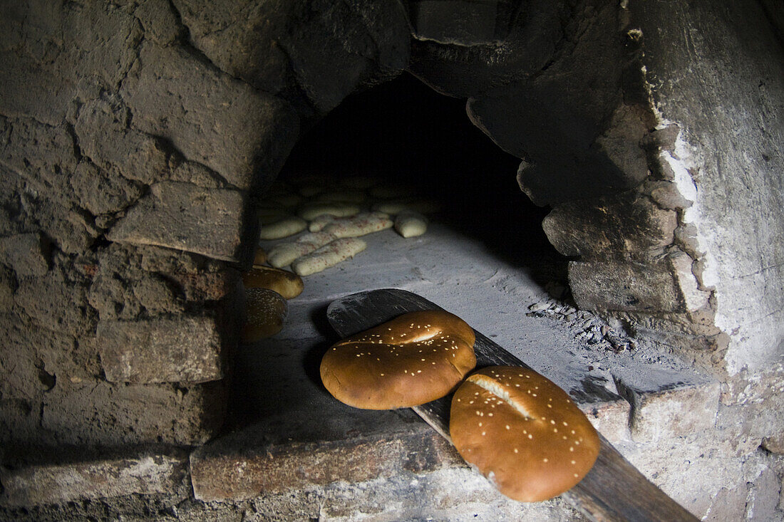 'Bread bakes in a traditional bread oven in Santa Catarina Lachatao, part of the Pueblos Mancomunados, a network Zapotec villages in the Sierra Norte Mountains of Oaxaca state, Mexico on July 16, 2008. The Pueblos Mancomunados, literally ''joint villages'