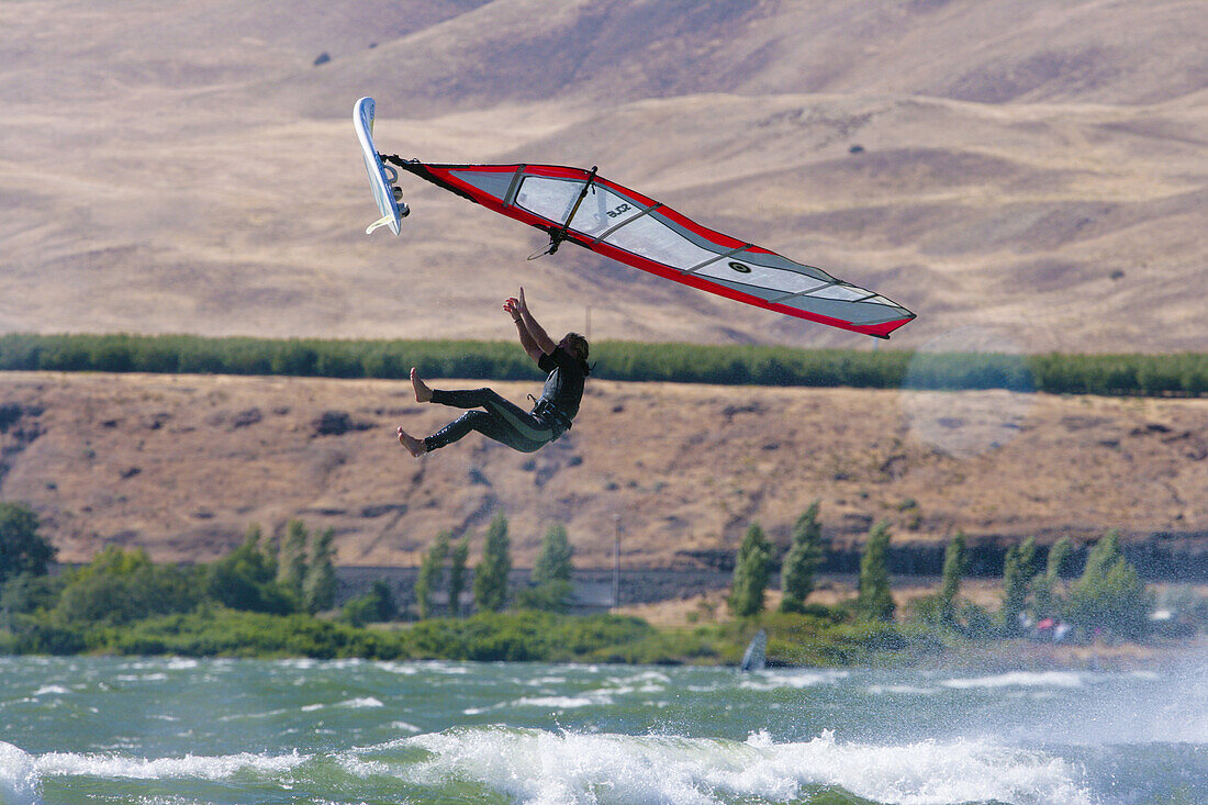 Windsurfer in suspended animation mid back loop - Arlington, OR.