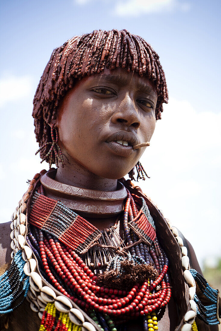 HAMER VILLAGE, OMO VALLEY, ETHIOPIA. A portrait of a young woman in the Hamer Village in the remote Omo Valley of Ethiopia.