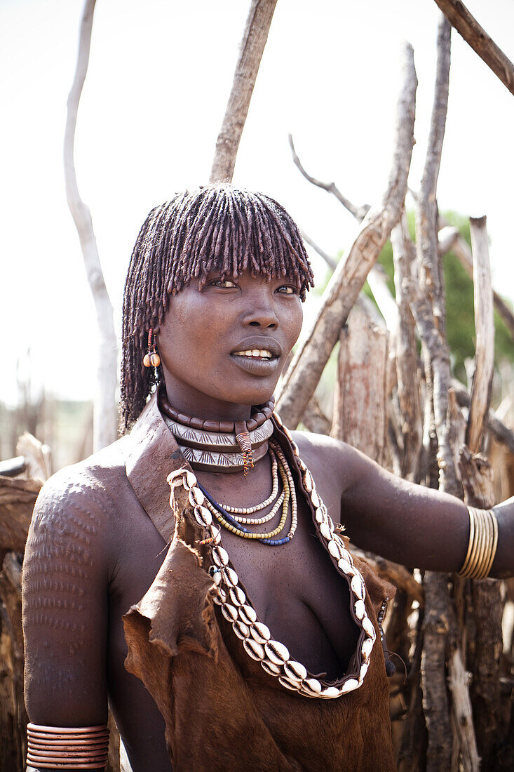 HAMER VILLAGE, OMO VALLEY, ETHIOPIA. A portrait of a young woman in the Hamer Village in the remote Omo Valley of Ethiopia.