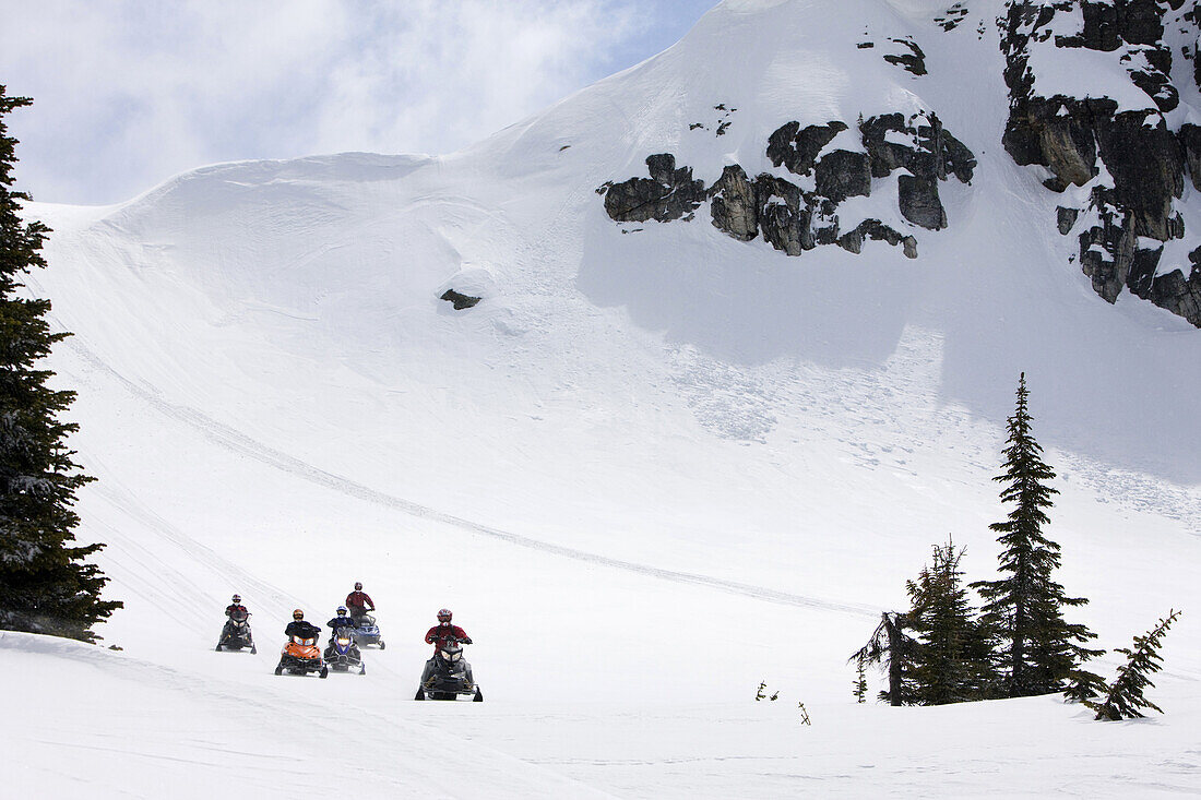 Snowmobiling on Owlshead Mountain above Sicamous, British Columbia, Canada.