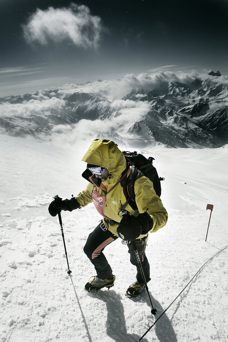Three people on Elbrus Mountain during Elbrus Race, the highest race in Europe.