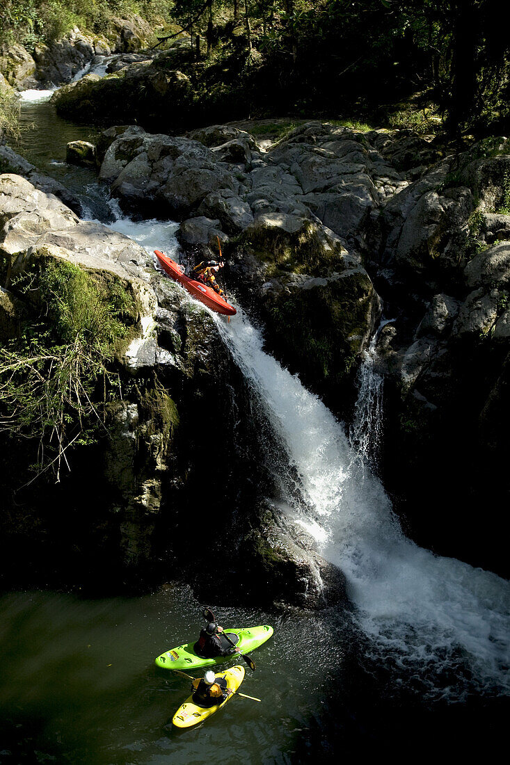 'Nick Troutman dropping the first rapid of the day while Eric and Dan Jackson look on while kayaking the ''Roadside'' section of the Alsaseca River near Tlampacoya, Mexico.'