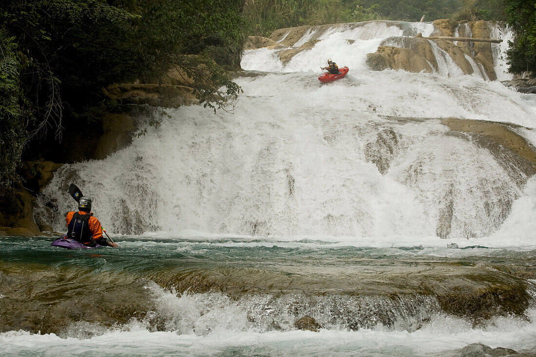 Clay Wright waits for Nick Troutman to make it down a set of slides in Agua Azul, Mexico.
