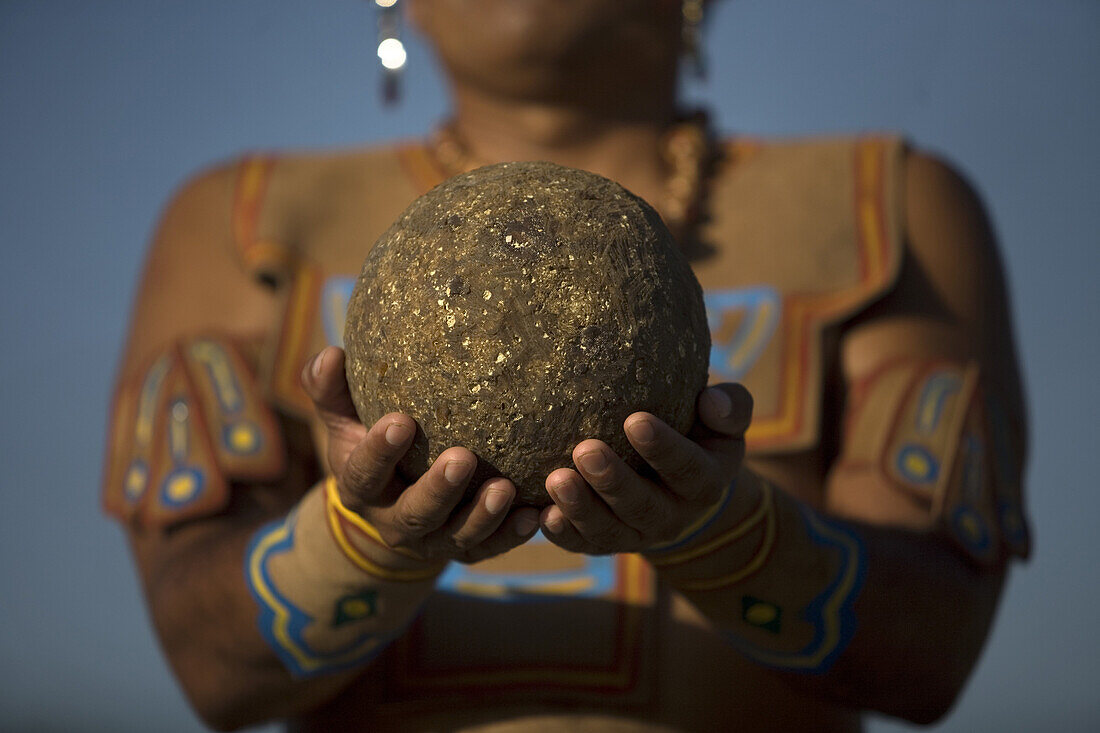 A Mayan ball player holds up the ball made of hule, natural rubber, in Chapab village in Yucatan state in Mexico's Yucatan peninsula, June 14, 2009.