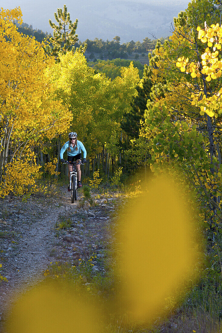 Heather Swallow enjoys an evening mountain bike ride on a beautiful Fall evening near Gold Hill, CO.