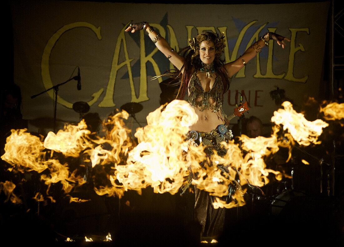 A member of Mutaytor, a performance group of 30 drummers, fire-spinnners and dancers, performs at Venice Carnevale on Windward Ave., in Venice, Calif., on Saturday, June 6, 2009. The annual festival, dubbed â€œThe Costumed Celebration by the Sea,â€_ featu