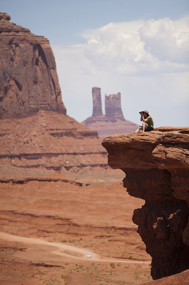Tourists enjoy the views at John Ford's Point at Monument Valley Navajo Tribal Park in southern Utah. The park, operated by the tribe, was once a popular set for western films of the 1930s through 60s. It is immensely popular among European tourists.