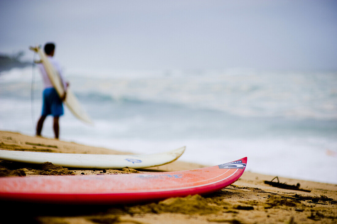 Surfer scene a day before the 25th Eddie Aikau Big Wave Invitational. The biggest swell on the North Shore for 10 years brought 30-50 foot waves to Waimea Bay, Hawaii.