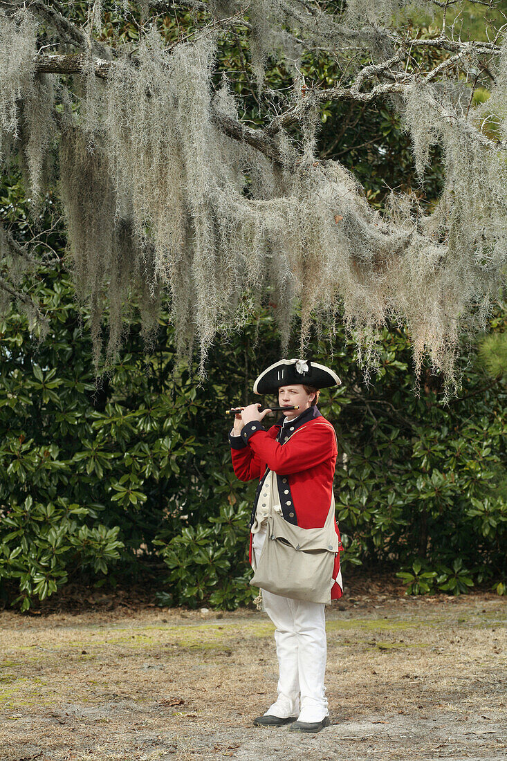 234th Anniversary of the Battle of Moores Creek Bridge, Revolutionary War - Moores Creek National Battleground. Portraits of Reenactors.   Sean Hartness plays a fife as an American Musician Musicians wore opposite colored uniforms on both sides of Revolut