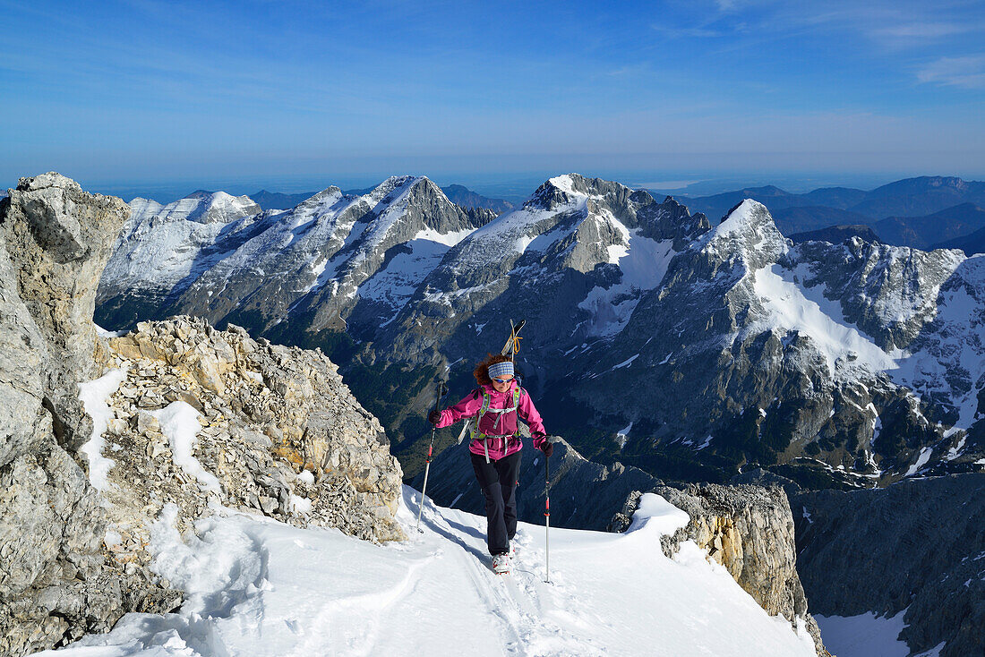 Female back-country skier ascending to Birkkarspitze, Karwendel range, Tyrol, Austria