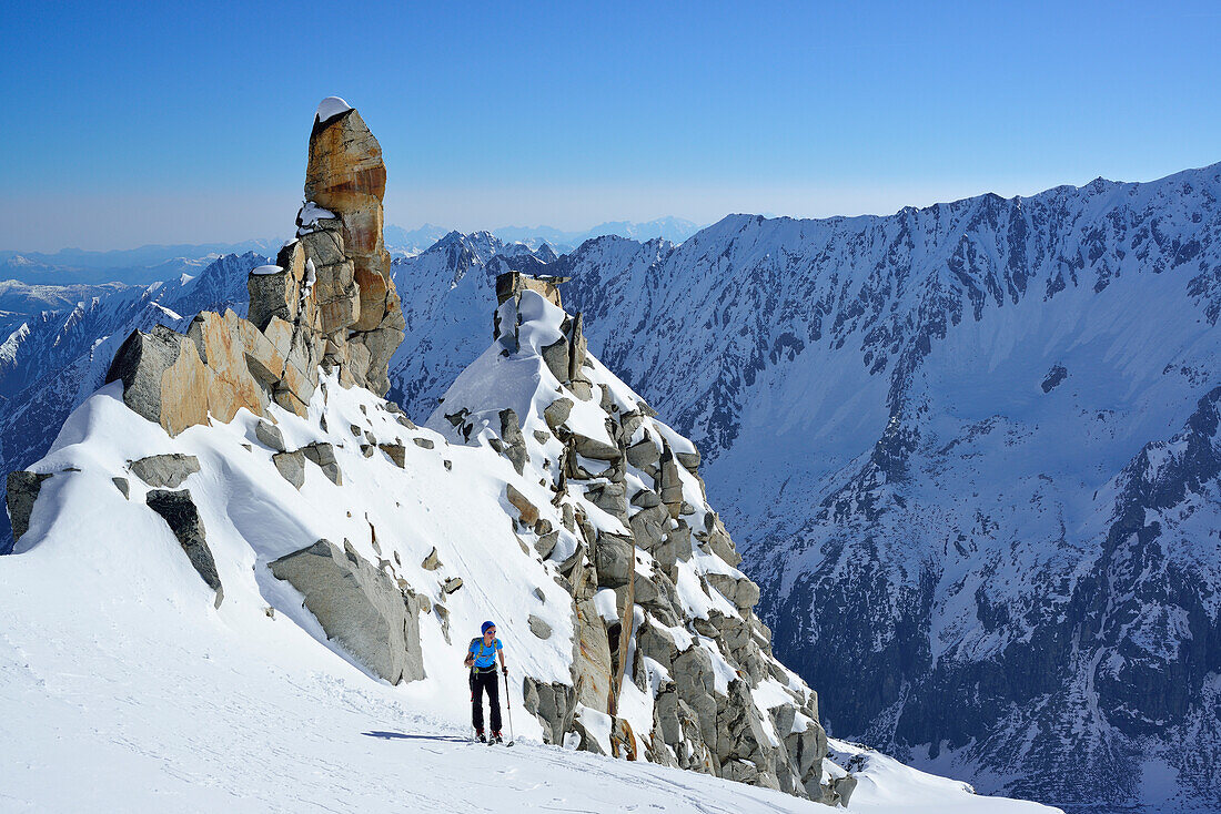 Female back-country skier ascending to Schlieferspitze, Venediger Group, High Tauern National Park, Salzburg, Austria