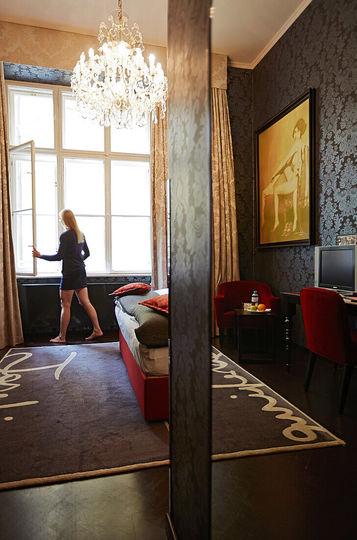Woman in room no. 08, hall and room designed by Matteo Thun, Altstadt Vienna Hotel, Kirchengasse 41, 7th district, Vienna, Austria