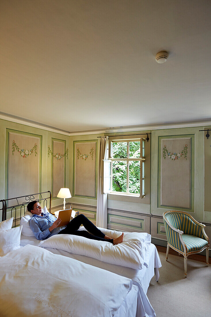 Woman in a room with mural paintings from the 18th century, Villa Sorgenfrei, country hotel, Augustusweg 48, Radebeul, Dresden, Germany