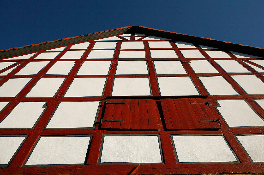 Half-timbered barn with red beams, Odershausen, Bad Wildungen, Hesse, Germany, Europe