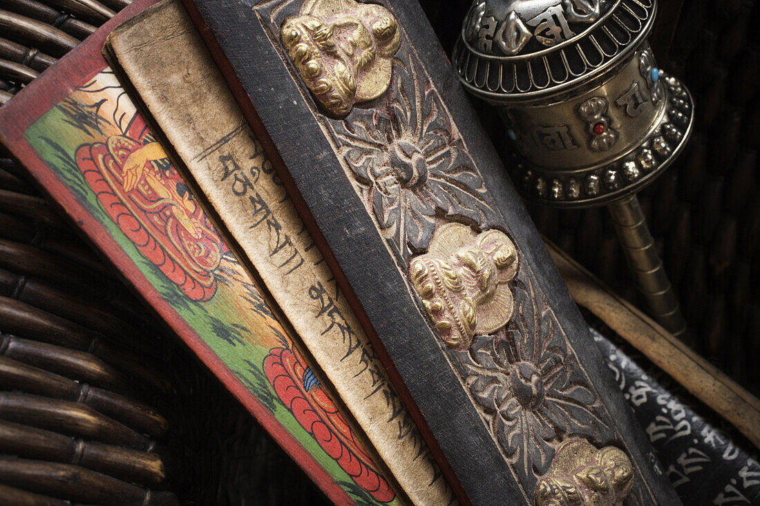 Close-up of Tibetan prayer holders and a prayer wheel.  Ron Koeberer / Aurora Photos 