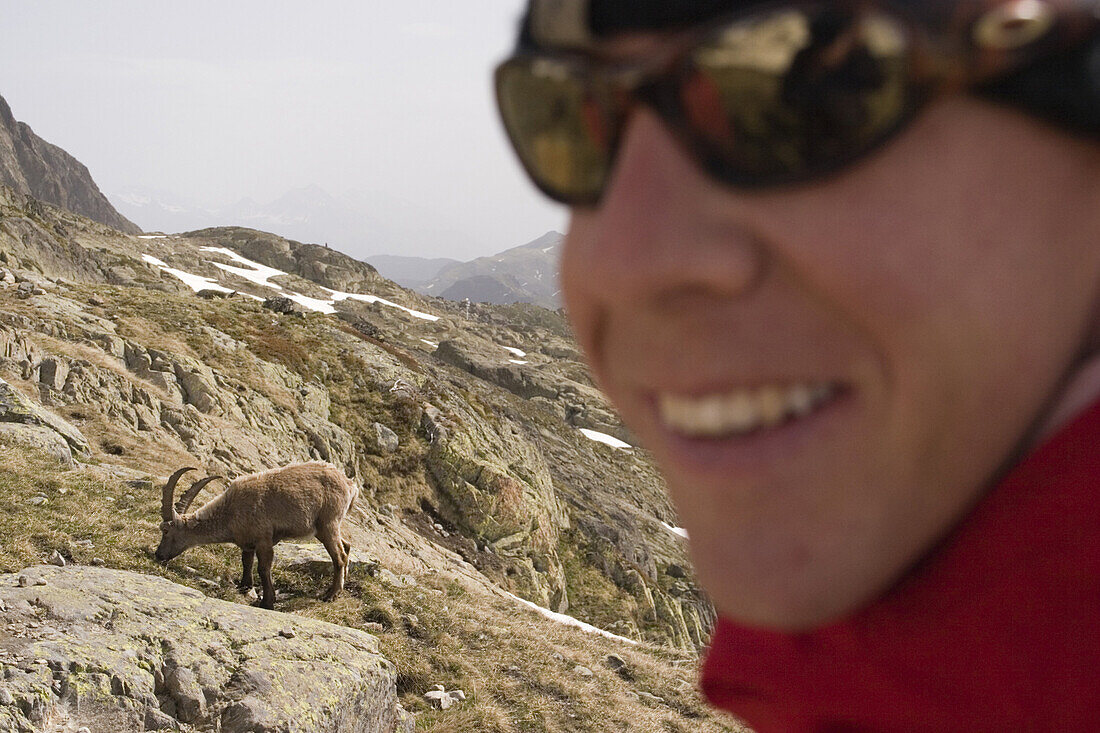 A smiling man and an ibex near Mont Blanc in the French Alps.