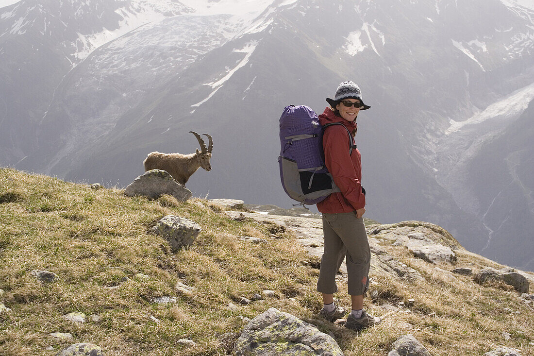 A woman and an ibex near Mont Blanc in the French Alps.