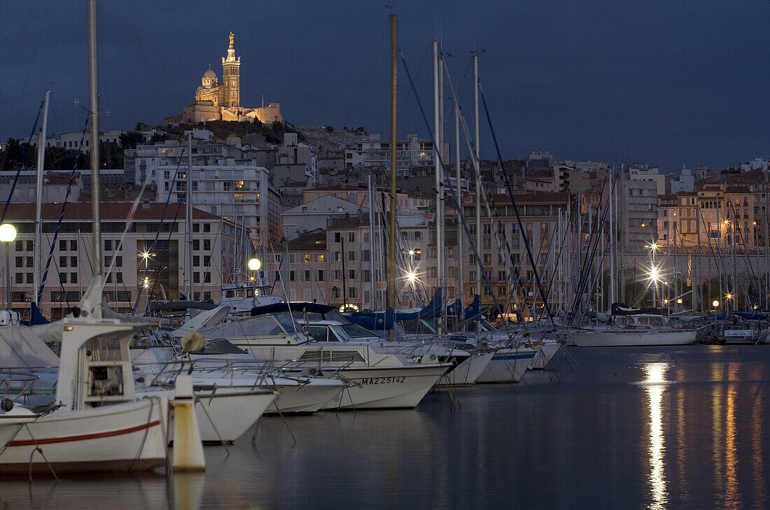 'Notre Dame de la Garde sits on the highest natural point of the city of Marseille, above the ''Vieux-port'' or Old Port, France.'