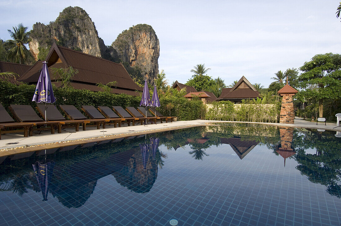 Views of the Thaiwant Wall, a famous climbing destination in Railay, from one of the the pools of the Railay Bay Resort and Spa, a newly remodeled resort catering to the wealthier crowd.