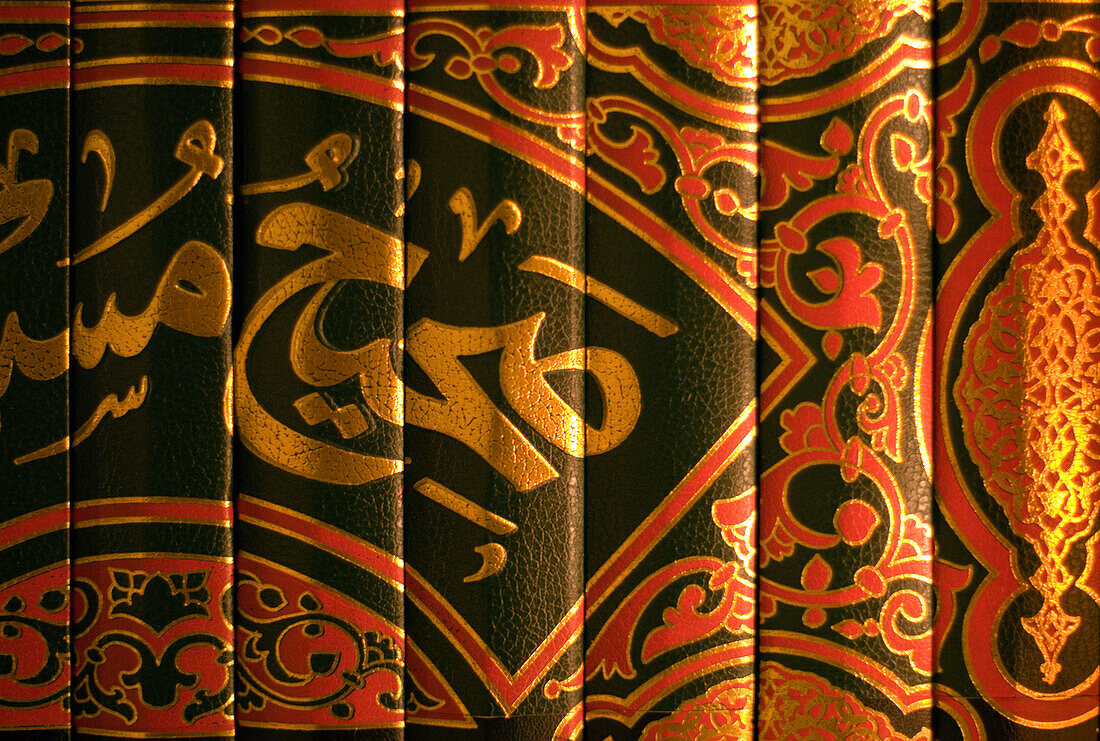 Gold embossed Arabic script decorates book bindings in the library of the Burj al Arab Arabian Tower, the world's tallest  hotel at 321 meters, on the beach along the Persian Gulf, Dubai, United Arab Emirates.  A super luxury hotel, the Burj al Arab and i