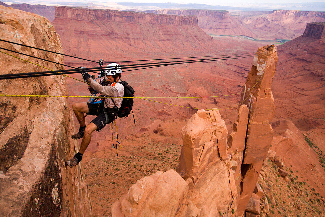 An unknown racer crossing a Tyrolean Traverse during the ropes leg of day eight of the 2006 Primal Quest adventure race in Moab, Utah.  It was the largest expedition adventure race ever held with 95 co-ed teams of four covering 400 miles in 5-10 days in h