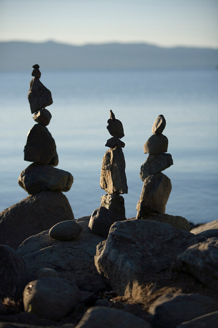 Three rock cairns along the shores of Lake Tahoe, California.