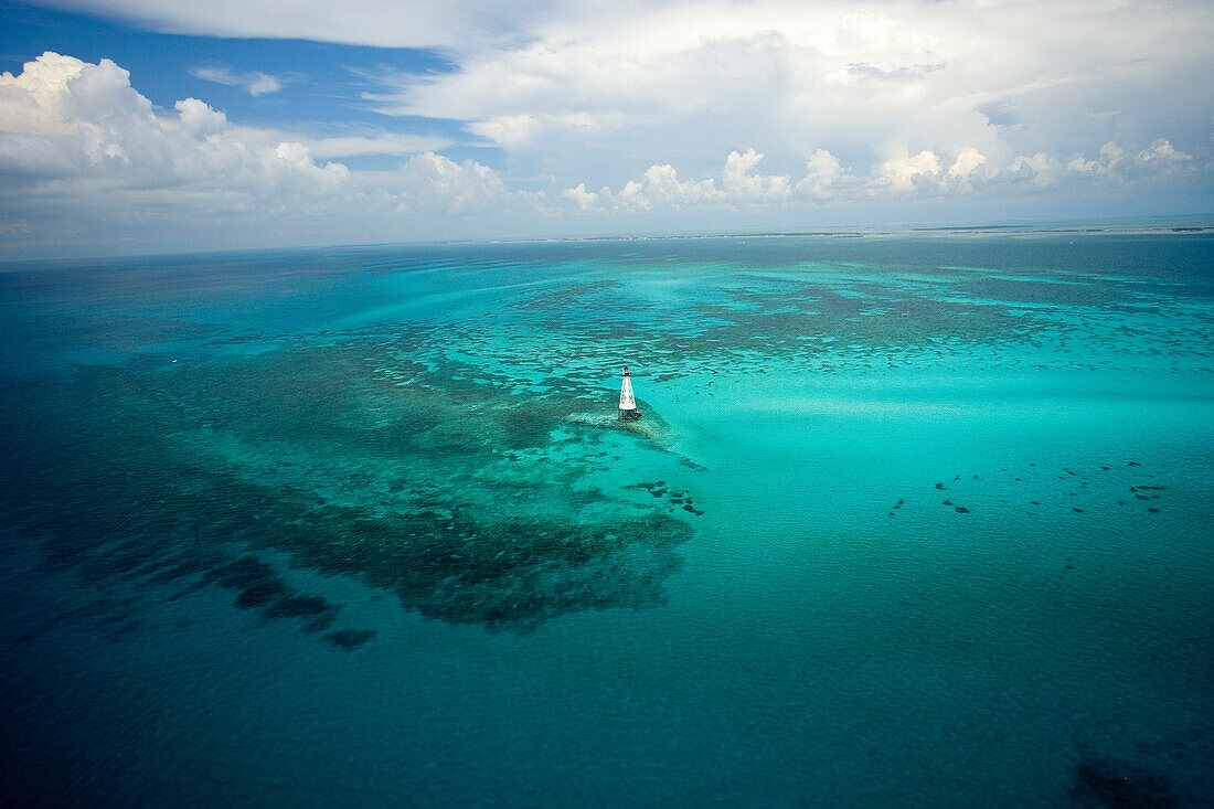 Aerial view of Allligator Reef Light and surround waters.  Underwater topography reflects the spur and groove coral formations common throughout the Florida Keys