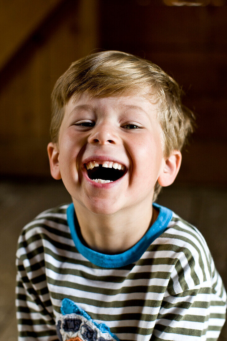 Portrait of a boy laughing in North Yarmouth, Maine. releasecode: DM_MR1039