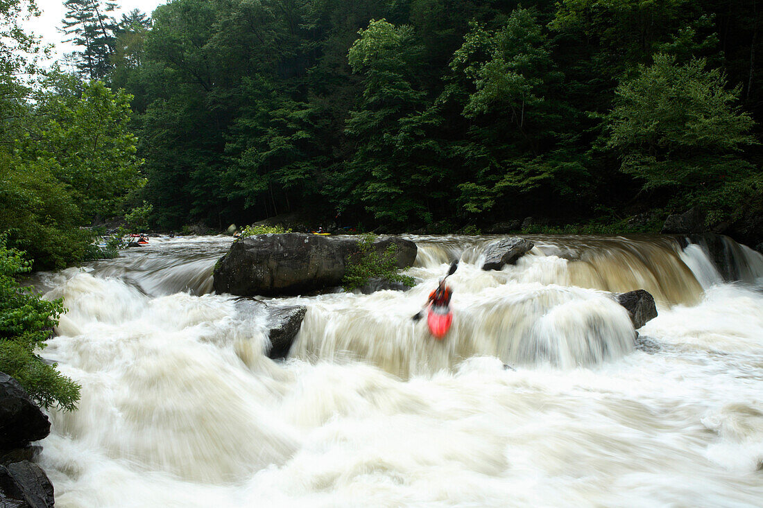 Zoom blur image of unknown kayaker running Bear Creek Falls on the Cheoah River near Robbinsville, NC. Zoom blur image of unknown rafters running the Cheoah River near Robbinsville, NC. This river was only recently opened to whitewater enthusiasts and onl