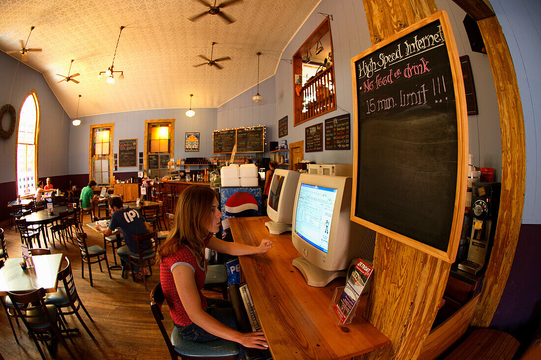 Lydia McDonald checks her email at the Cathedral Cafe in downtown Fayetteville, WV