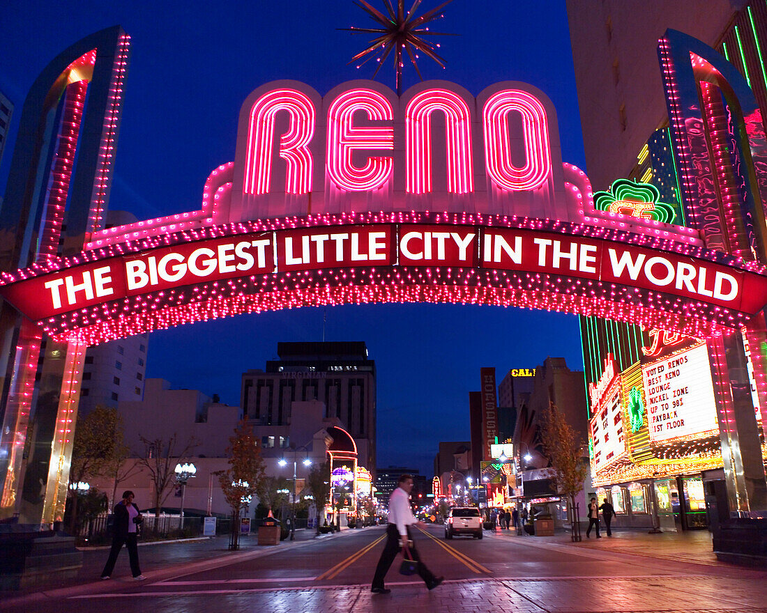 'Glittering icon archway advertising ''''Reno - The Biggest Little City In the World'' at night, leading into the casino quarter in Reno, NV.'