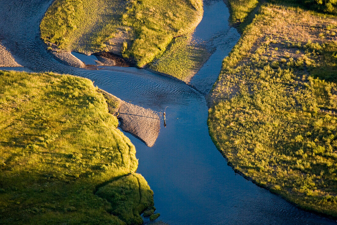 An aerial view of a fly fisherman playing a fish in the braided Lamar River of the Lamar Valley in Yellowstone National Park, Wyoming on August 3, 2005.