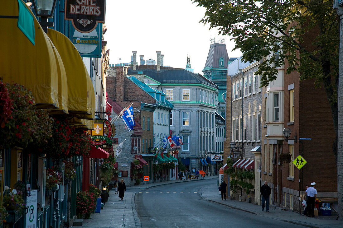 People walk along the Rue St. Louis in Old Quebec, a World Heritage Site in Quebec, Canada.