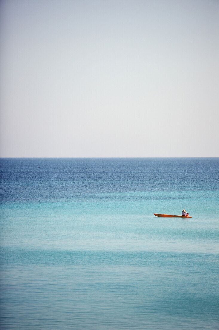 A man drifts in his boat on the blue waters off the beaches of Varadero, Cuba. The cuban government has long been trying to make Varadero the cuban equivalent of Cancun.