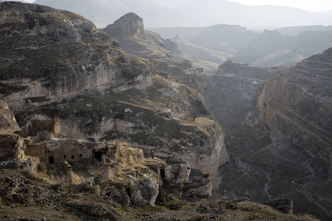 Hasankeyf, Southeastern Anatolia, Turkey - January, 2008:  Honey colored village which clings to the sleep rocks above the Tigris River. The historical town is scheduled to be flooded in the future when the ilisu dam is completed.