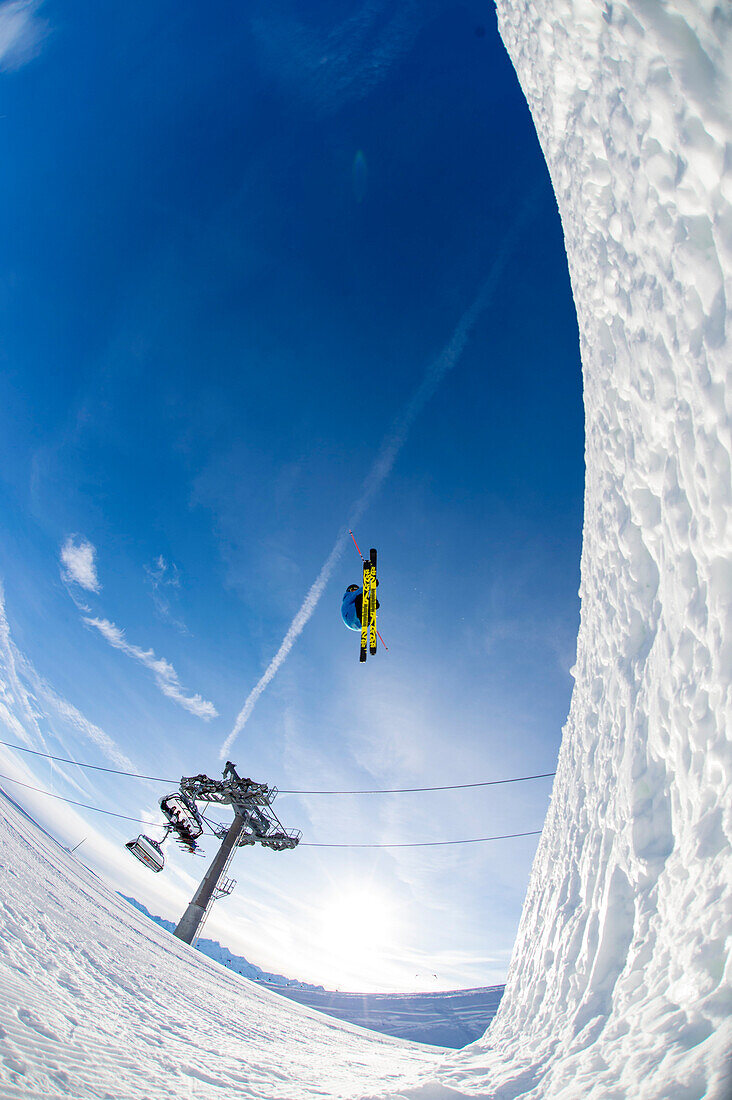 Skier jumping over big kicker in the funpark, Betterpark, Kaltenbach, Zillertal, Austria