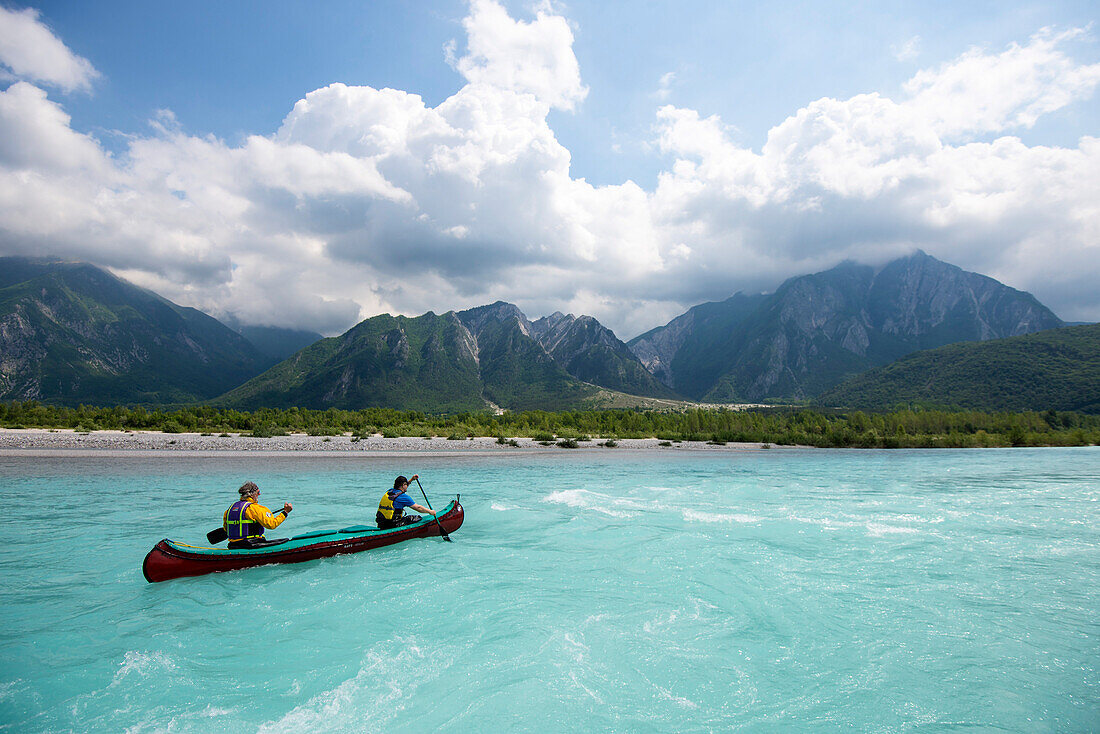 Canoeing on the blue waters of the Talgliamento, Tolmezzo, Italy