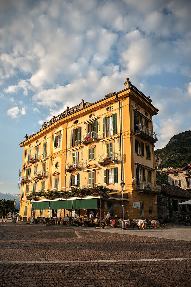 Yellow historic hotel in Varenna, Lake Como, Lombardy, Italy, Europe