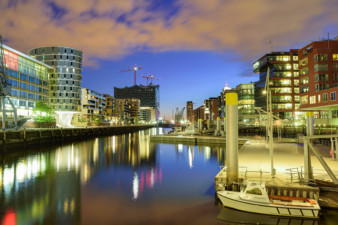 Illuminated port Sandtorhafen with Elbphilharmonie in background, Hafencity, Hamburg, Germany