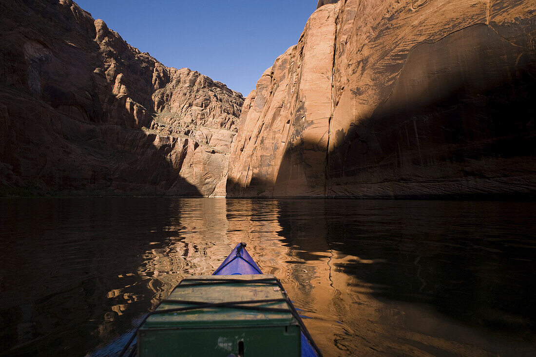 Paddling on the Colorado River below the Glen Canyon Dam. The 17-mile stretch of canyon between the dam and Lee's Ferry, where boats trips start the ten-day run through the Grand Canyon, is a low-traffic spot for two-day float trips on canoe, kayak or raf