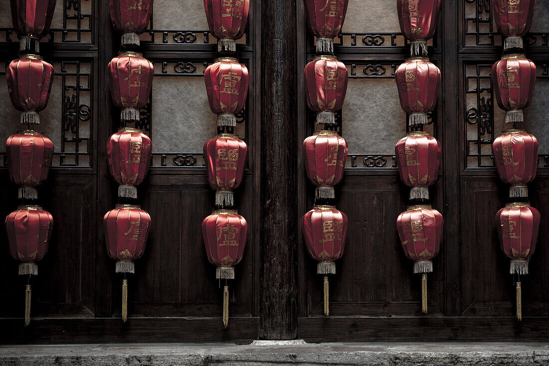 Lamps adorn a wall at an historic residence of a salt merchant now open to the public in Yangzhou, China, a suburb city of Shanghai and major producer of photovoltaic cells for solar power.