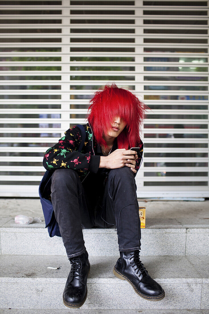 Portrait of a young punk, Taipei, Taiwan, October 30, 2010.  Radical styles push up against conservative parents, intense schooling, uniforms and a structured life where most decisions are out of the youth's hands.