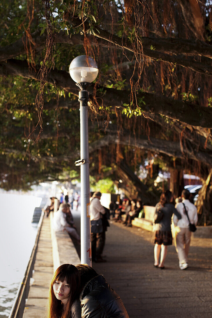 A young couple embraces on the waterfront in Danshui, Taiwan, November 9, 2010.